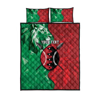 Green/red quilted bed set flat lay with lion shield graphic and two pillowcases