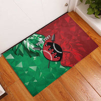 Rubber doormat with diagonal green-to-red pattern, lion emblem, and 'YOUR TEXT'