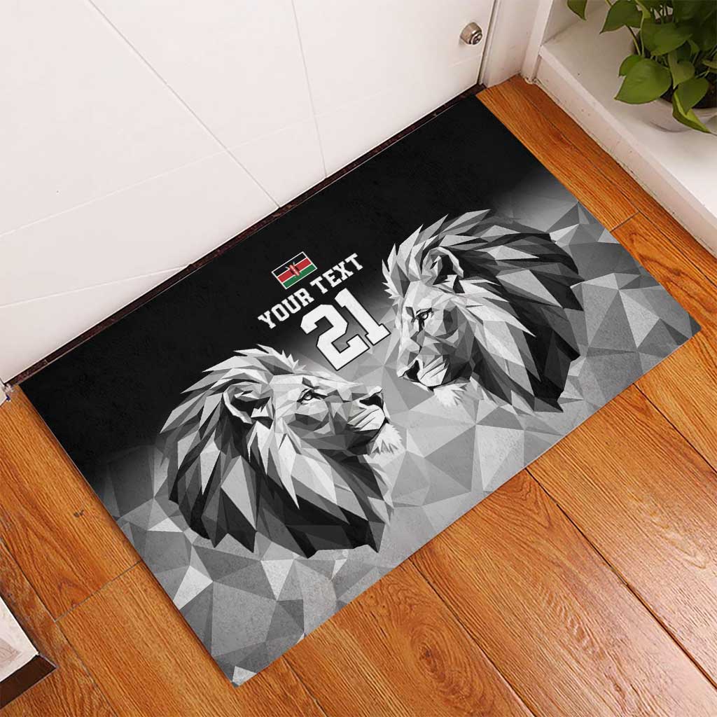 Black rubber doormat with geometric lions, Kenya flag emblem, and '21' near doorway