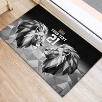 Black rubber doormat showing geometric lions facing, Kenya flag, and large '21'