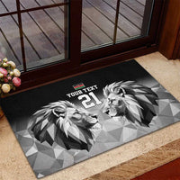 Black rubber doormat with lion duo graphic, Kenya flag emblem, and '21' on patio