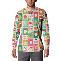 Beige Christmas button sweatshirt with Yule Lads pattern, worn by model