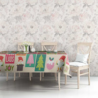 Christmas tablecloth with bright Yule lads artwork, trees, and festive shapes in repeating blocks