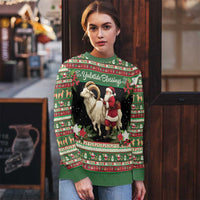 Green ugly Christmas sweater worn by model, goat and Santa graphic with “Yuletide Blessings”