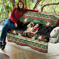 Personalized quilt draped on outdoor seating, goat and Santa with poinsettia stars