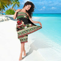 Green and black holiday sarong with goat and Santa scene and “Your text”