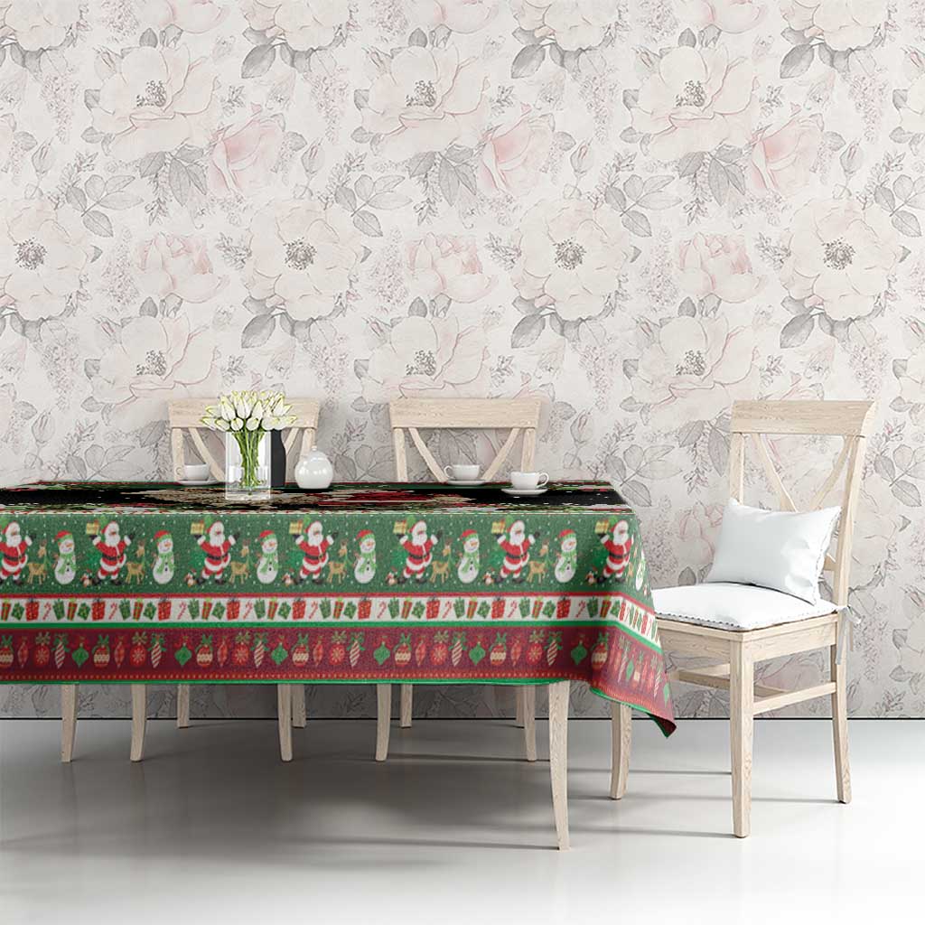 Green Scandinavian holiday tablecloth with goat and Santa motifs, red holly trim