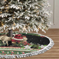 Round tree skirt with white fringe featuring goat and Santa over green and dark panels