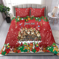 Red holiday duvet cover and pillowcases set with garland border and Santa-like figures