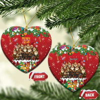 Red heart-shaped ceramic Christmas ornament with hanging loop, yule lads scene and holiday gifts