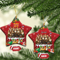 Red star-shaped ceramic Christmas ornament with hanging loop, yule lads scene and holiday gifts