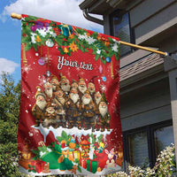 Red personalized garden flag on pole with Santa gnome group, ornaments, and snow
