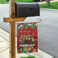 Red personalized garden flag on mailbox post with Santa gnome group and holiday gifts