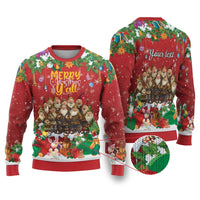 Red ugly Christmas sweater with colorful cartoon holiday scene, “Merry Christmas” text, long sleeves