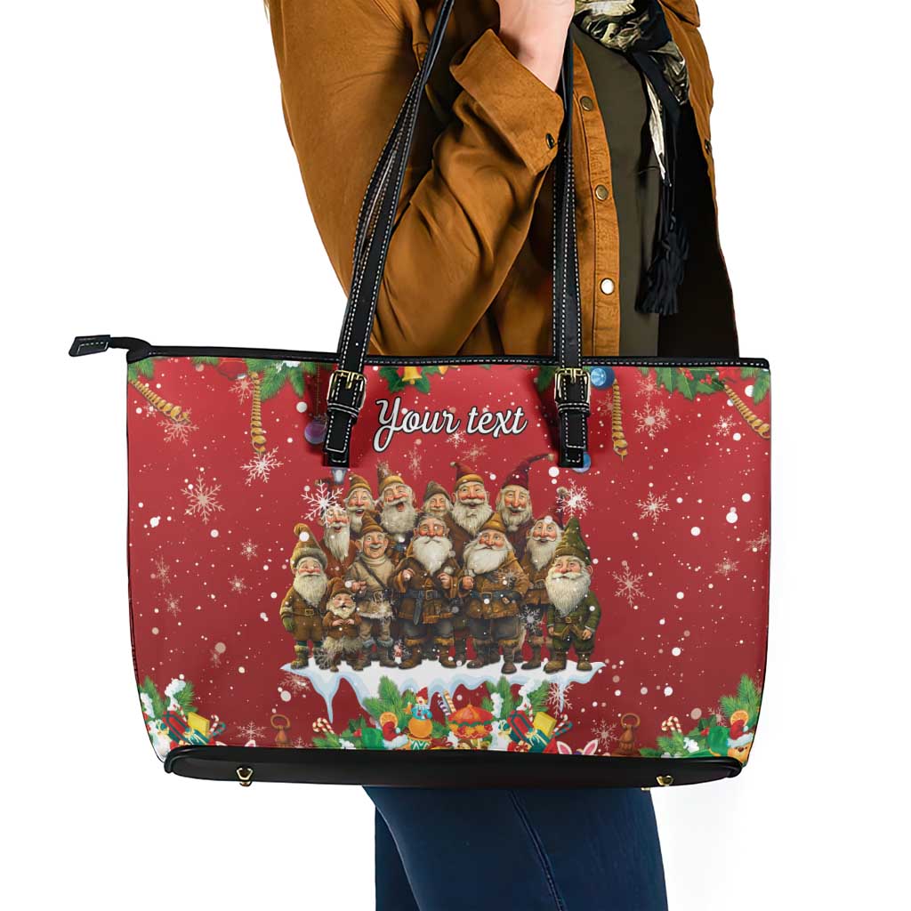 Red leather tote bag front view with black handles, zipper top, festive gnome scene and 'Your text'