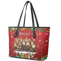 Red leather tote bag with double black handles and zipper top, festive gnome graphic and 'Your text'