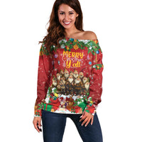 Women’s red off-shoulder sweater with festive holiday characters and gift graphic