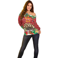 Women’s red off-shoulder holiday sweater with colorful Christmas character and tree print