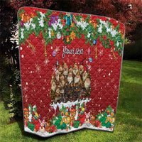 Red personalized quilt with "Your text" and a central Yule character group, diamond quilting.