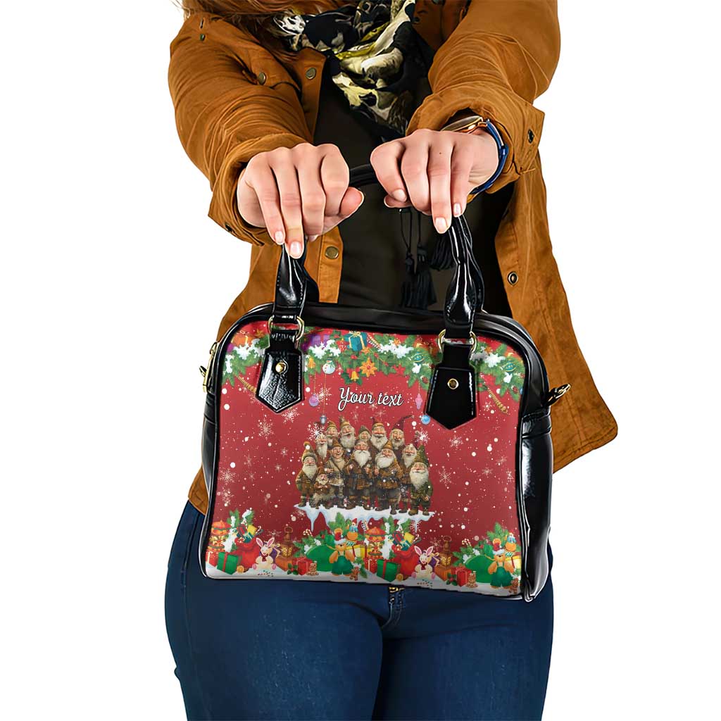 Red and black shoulder handbag with festive holiday print and two top handles.