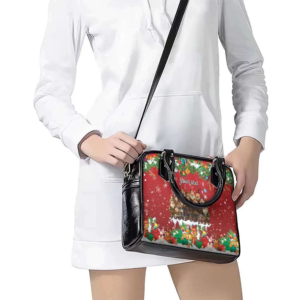Red and black crossbody handbag with curved top handle and holiday front print.