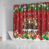 Red Christmas shower curtain showing Yule lads and gift characters at bottom border