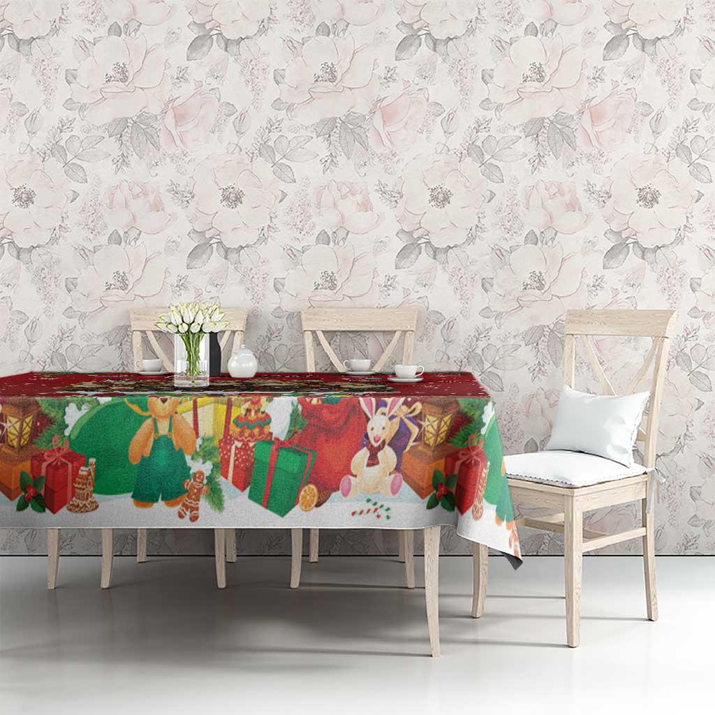 Red holiday tablecloth with bunny, gift, and wreath motifs across long dining table