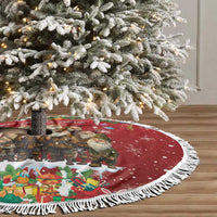 Red circular tree skirt with white fringed edge, elf and ornament scene