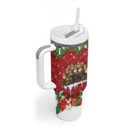Red holiday tumbler with white handle and lid, straw, festive character artwork and greenery