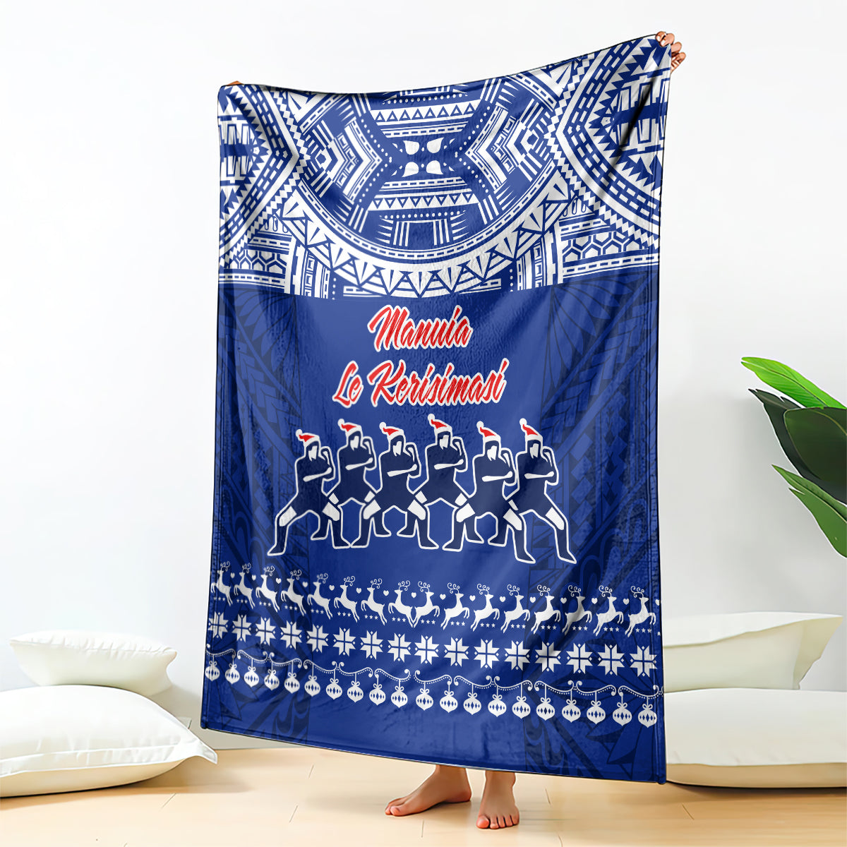 Blue Christmas blanket with white Samoan-style patterns and dancers, text across center.