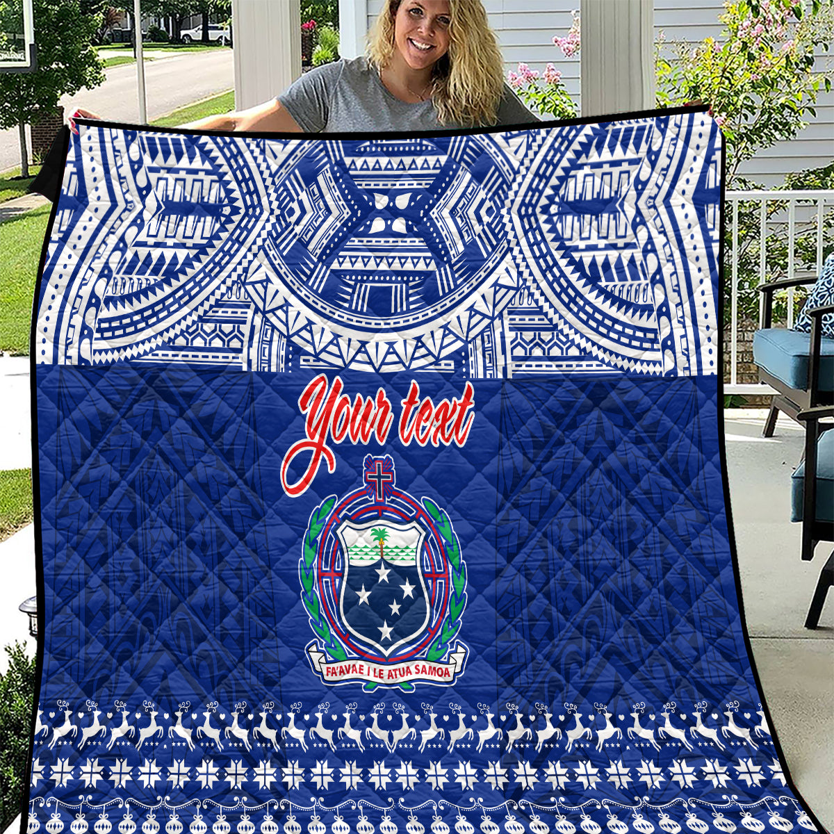 Blue Christmas quilt with white tribal pattern, 'Your team' script, crest emblem