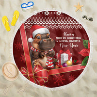 Red round beach blanket with white fringe, hippo with candy cane and holiday gifts