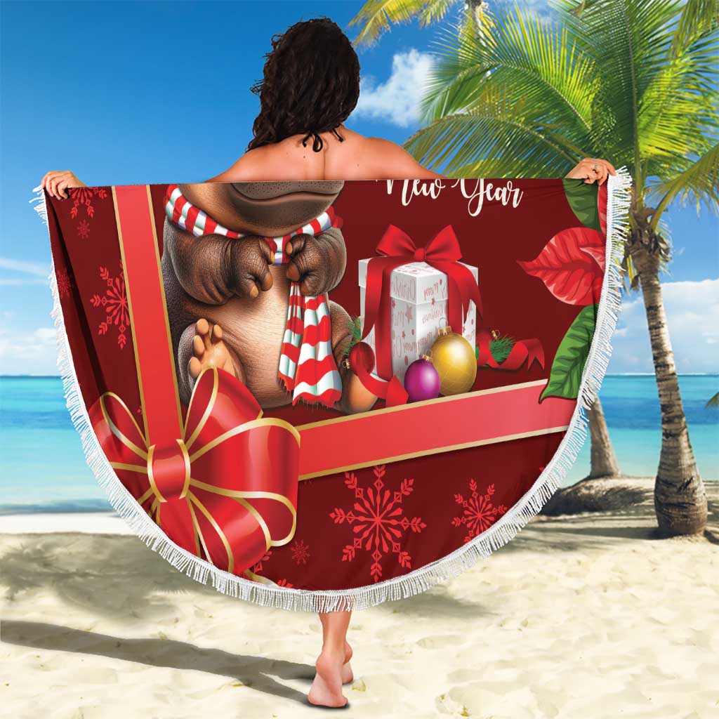 Red round beach blanket with white fringe, cartoon hippo in festive Christmas scene