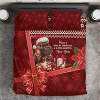 Red Christmas bedding set with cow character, snowflake pattern, gift bow, and two pillowcases
