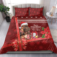 Red Christmas bedding set with cow mascot, festive border, poinsettia, and gift bow on bed