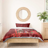 Red Christmas bedding set with cow Santa graphic, gift bow, and festive snowflake strip