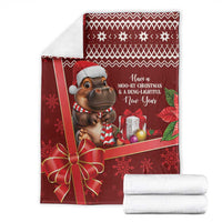 Red Christmas throw blanket with cartoon hippo in Santa hat and holiday message