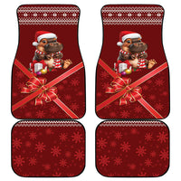 Four red Christmas car mats: two with cartoon animal, two with snowflake patterns