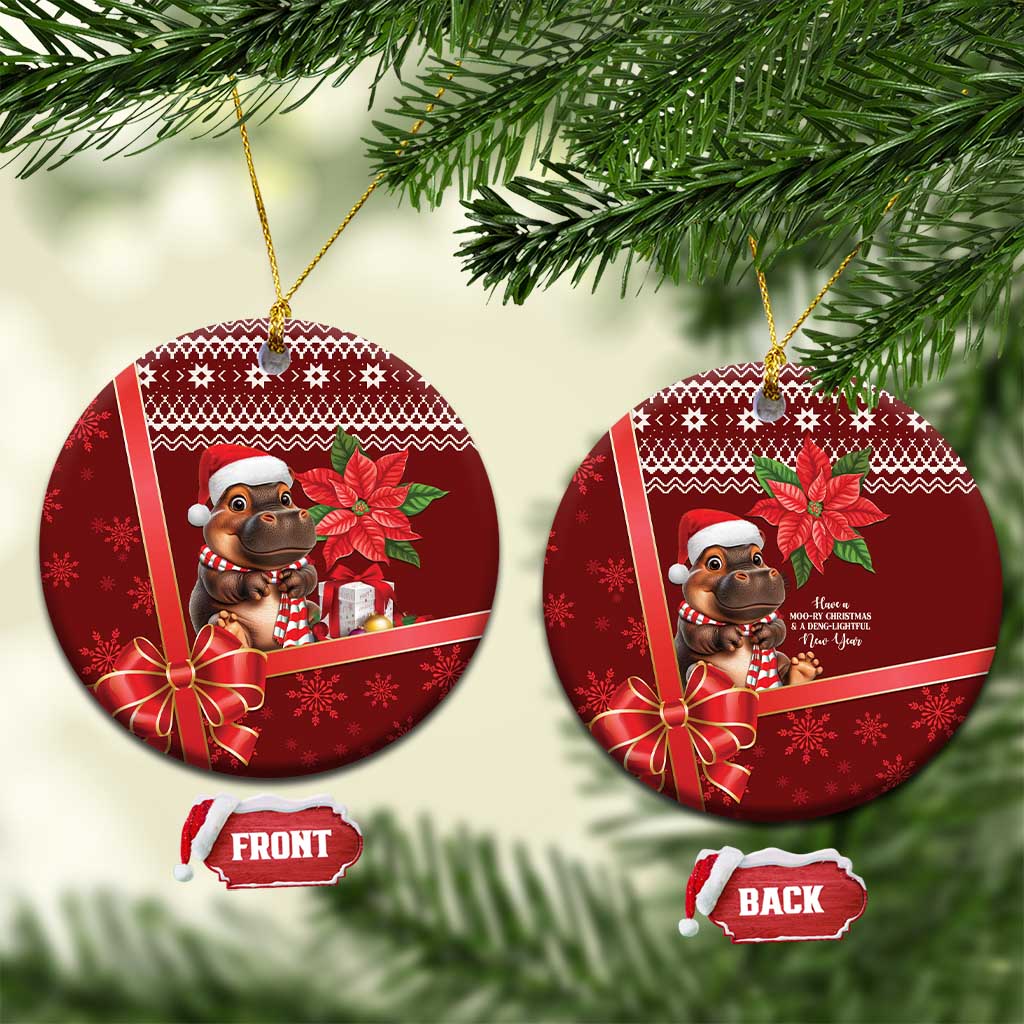 Red round ceramic Christmas ornament with cartoon cow in Santa hat, ribbon bow, gold loop