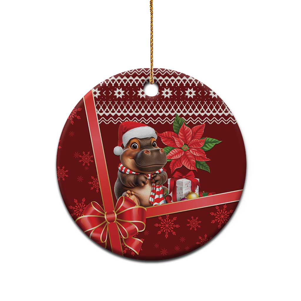 Red round ceramic Christmas ornament with cartoon cow, Santa hat, poinsettia flower, gold loop