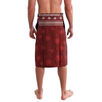 Red Christmas lavalava with repeating snowflake pattern and white waistband trim