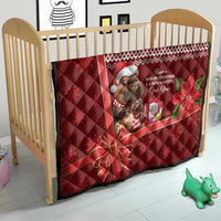 Red Christmas quilt on a crib, quilted fabric, cartoon mouse with gifts, poinsettia corner bow