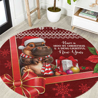 Red round Christmas carpet featuring a cartoon cow, holiday text, and gift images