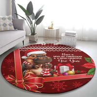 Red round Christmas carpet with cartoon cow, holiday banner text, and snowflake accents