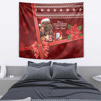 Red holiday tapestry featuring cartoon hippo, ribbon bow, gifts, poinsettias, snowflakes