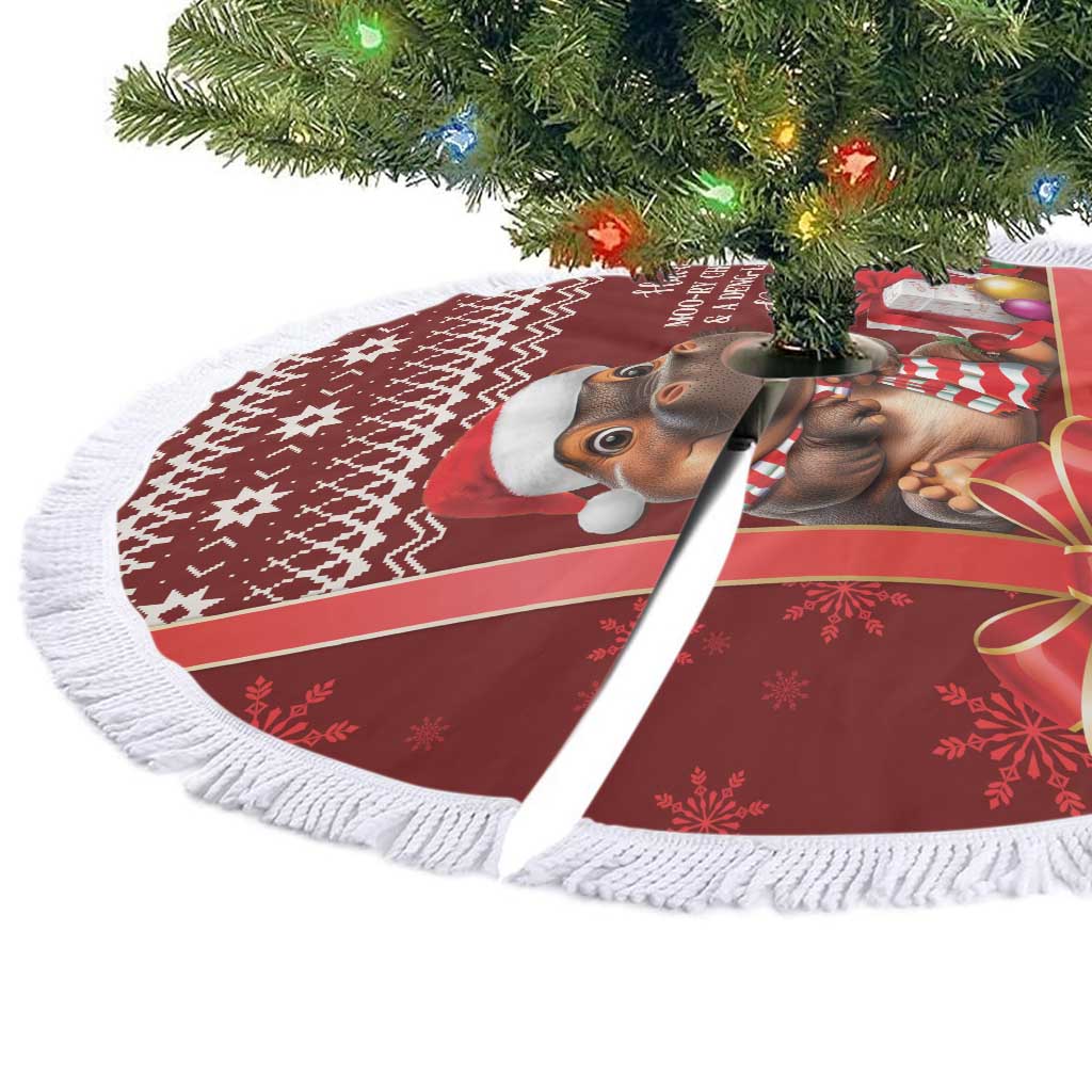 Red circular Christmas tree skirt with white fringe trim and cow graphic, shown from side
