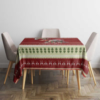 Red Christmas tablecloth with Santa baby hippo motif and green leaf stripe