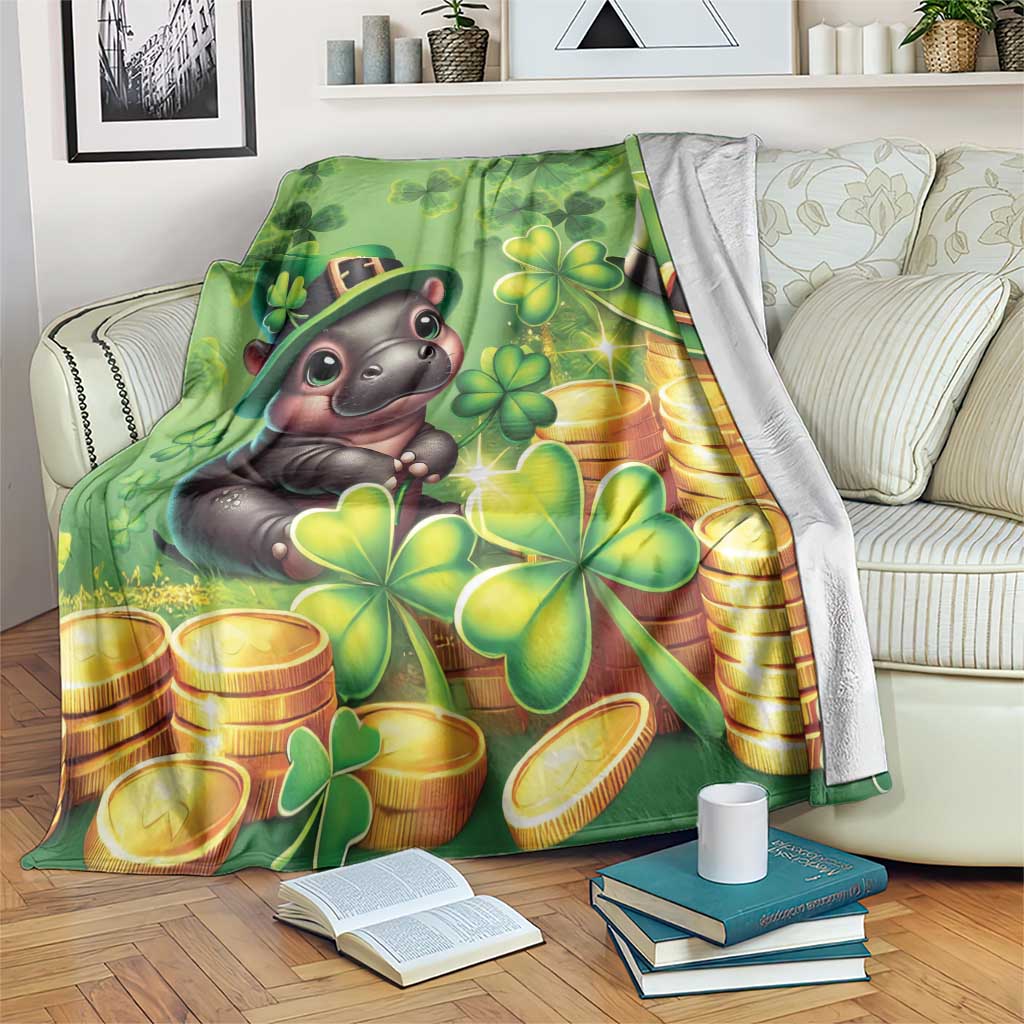 Green St. Patrick's Day blanket with cartoon hippo, clovers and gold coins, draped on couch