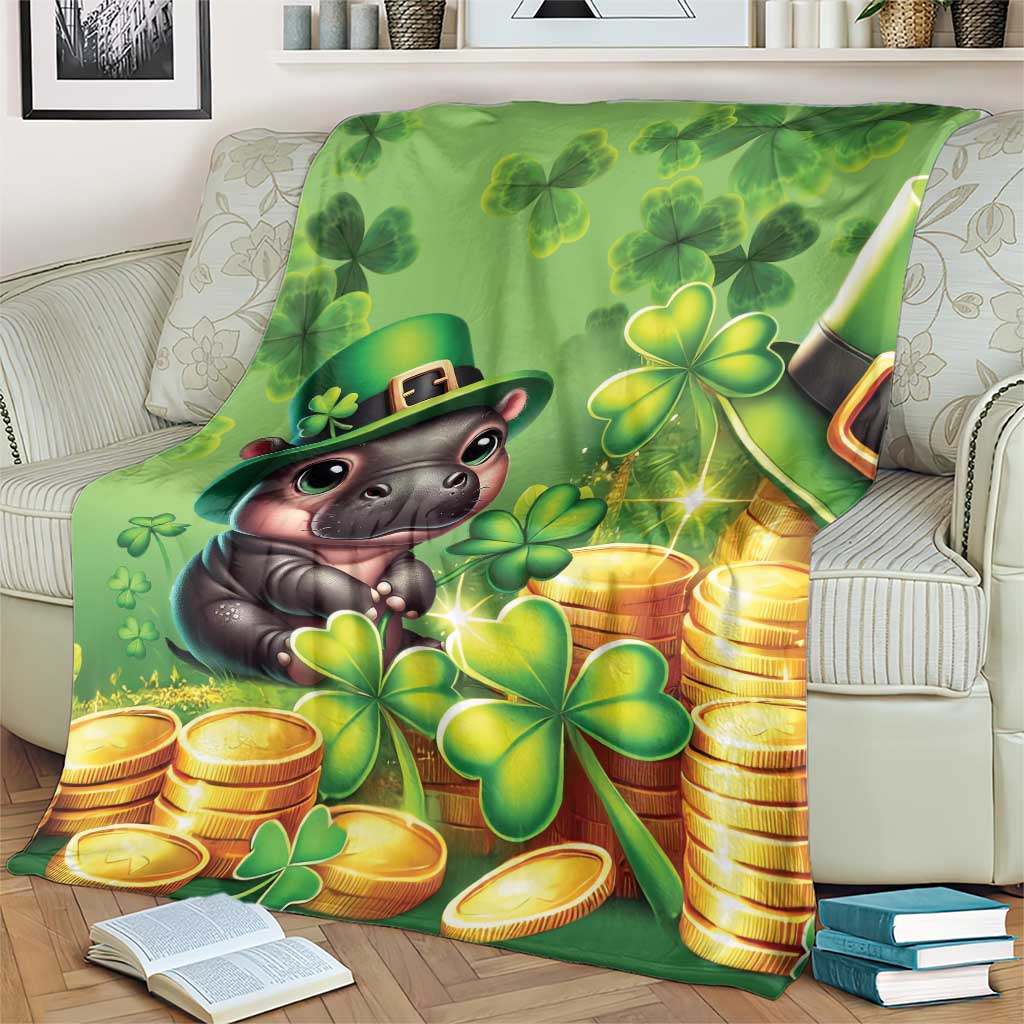 Green St. Patrick's Day blanket with cartoon hippo in hat, clovers and gold coins, draped close