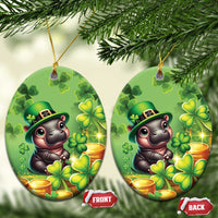 Green oval St. Patrick's Day ceramic ornament with cartoon bear, clovers, and gold coins.